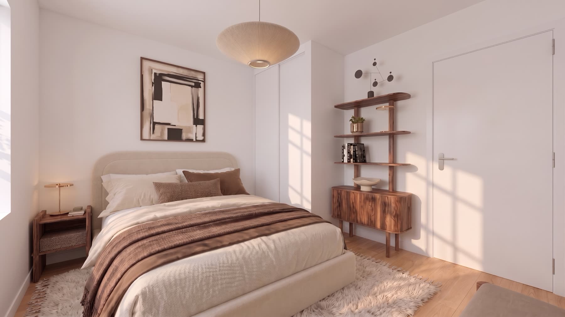 Chambre du T2 : tête de lit arrondie, étagère et buffet en noyer