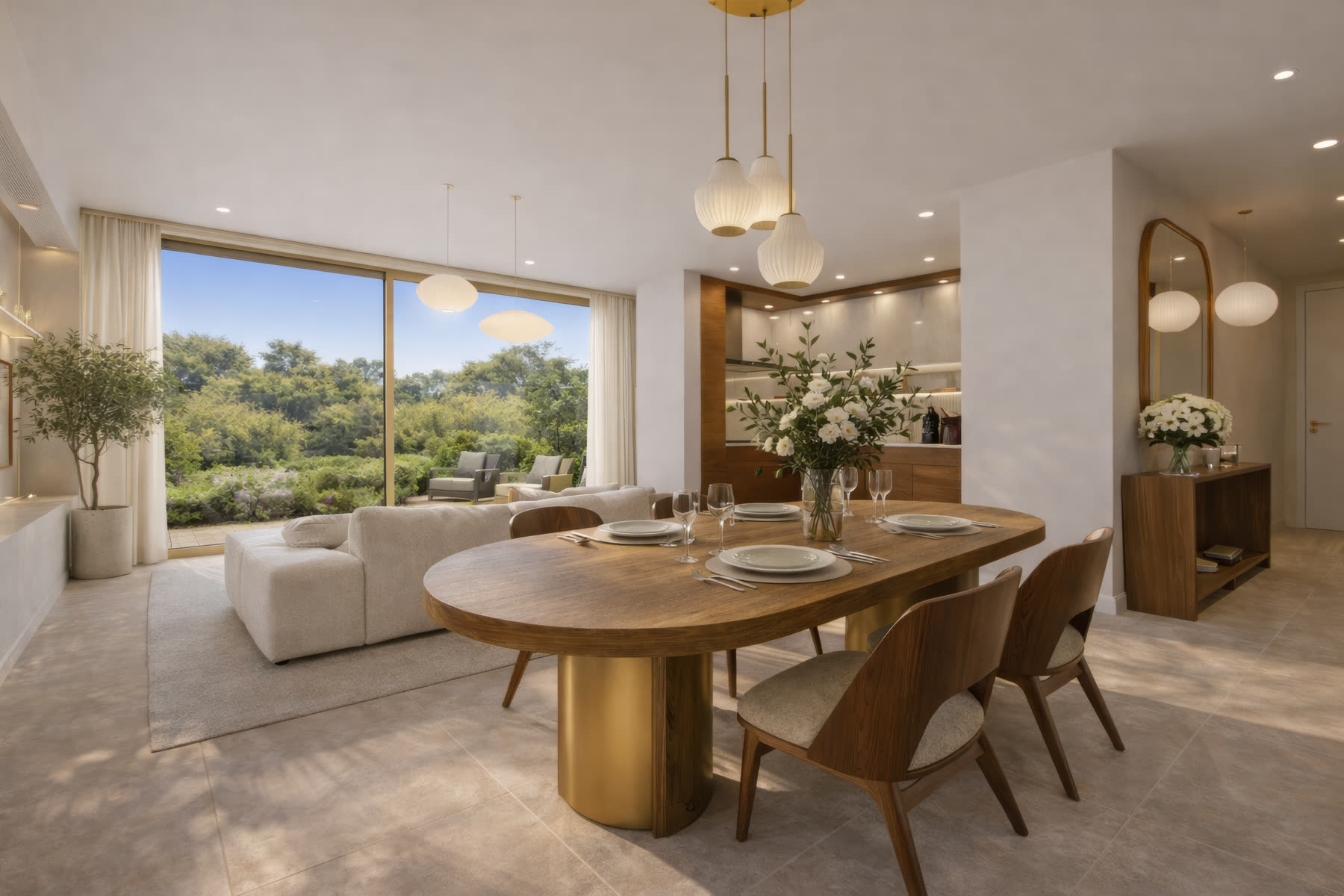 Séjour du T4 : table ovale en bois et laiton, canapé crème face à une baie ouverte sur le jardin